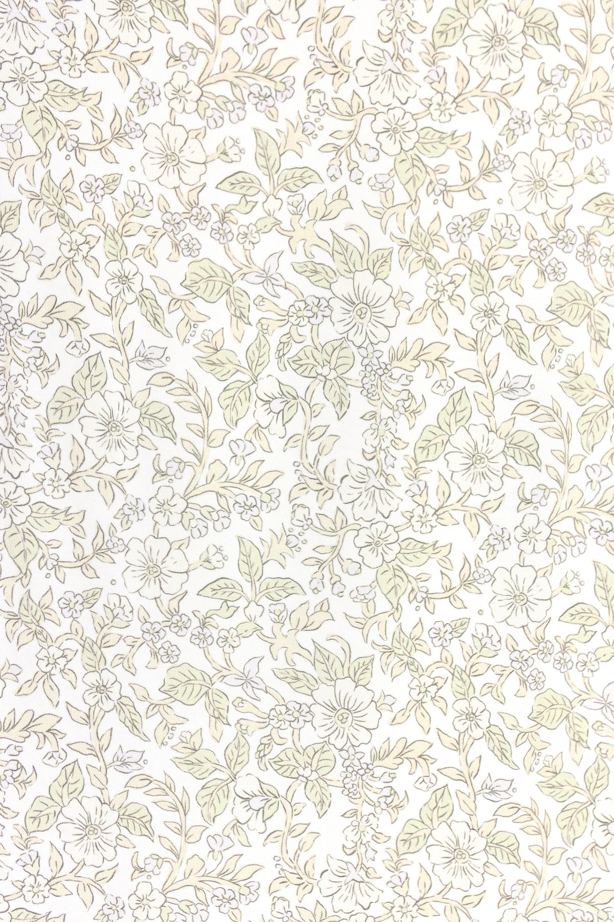 The heirloom / swaddle showcases a delicate, hand-drawn floral design in beige and light green on a white background, featuring various flowers, leaves, and small berries—perfect for a soft bamboo swaddle.