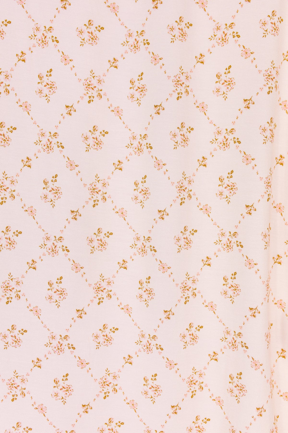 Light pink keepsake / swaddle with a delicate diamond pattern, adorned with small clusters of orange and brown flowers at each intersection, creates a soft, vintage-inspired look—perfect for a blush baby blanket or floral swaddle.
