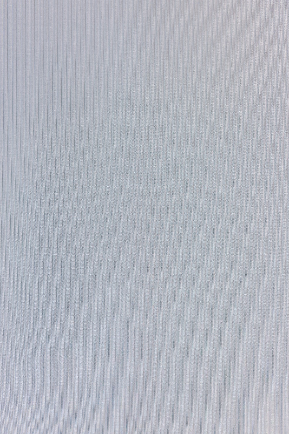 Soft light gray cove / swaddle fabric featuring a subtle vertical ribbed texture, similar to a classic bamboo swaddle. The evenly lit surface displays fine parallel lines running top to bottom, with no visible patterns or objects—just the textured material.