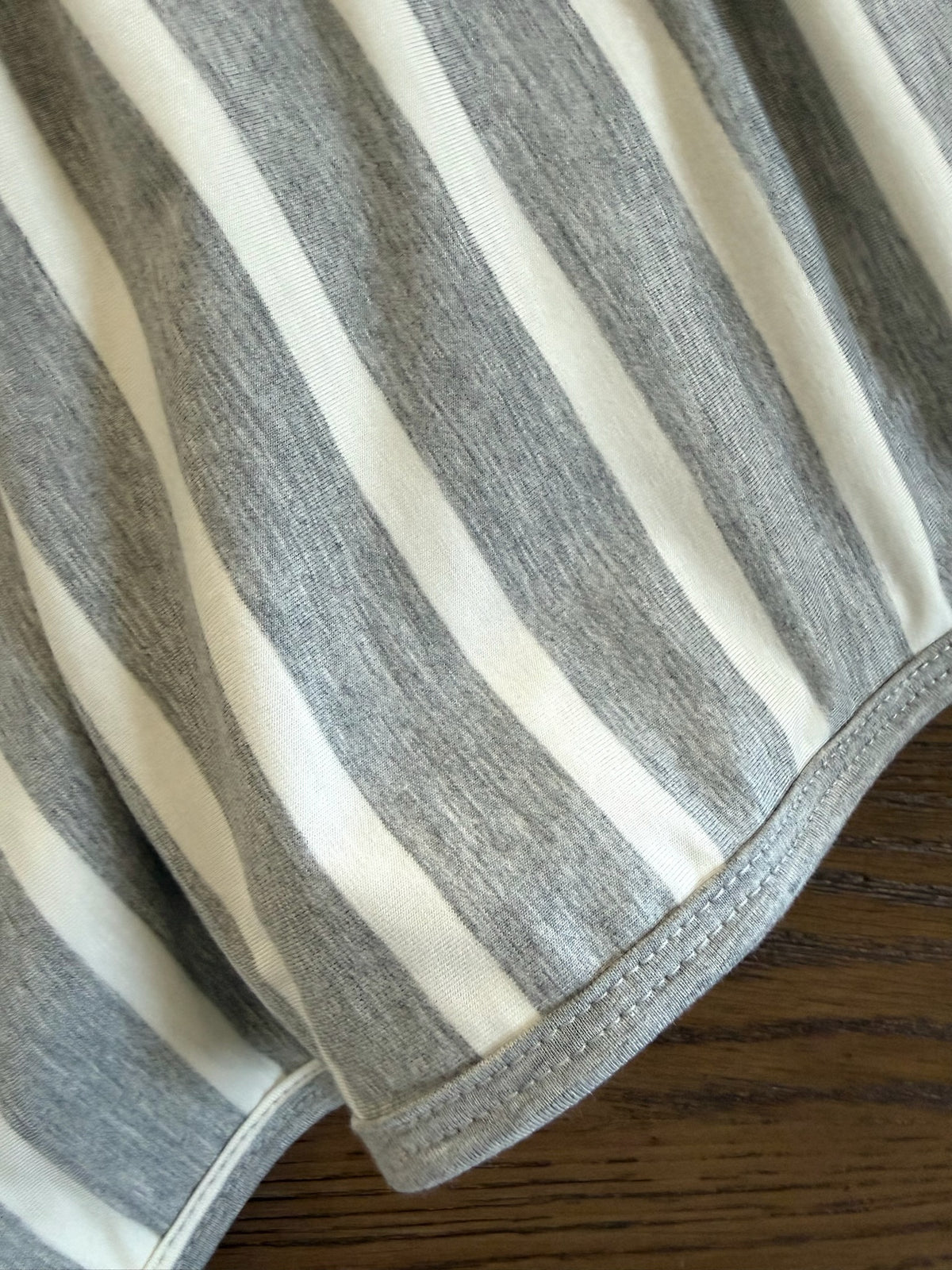 Timeless fabric in heather grey and white stripes with a finished edge.